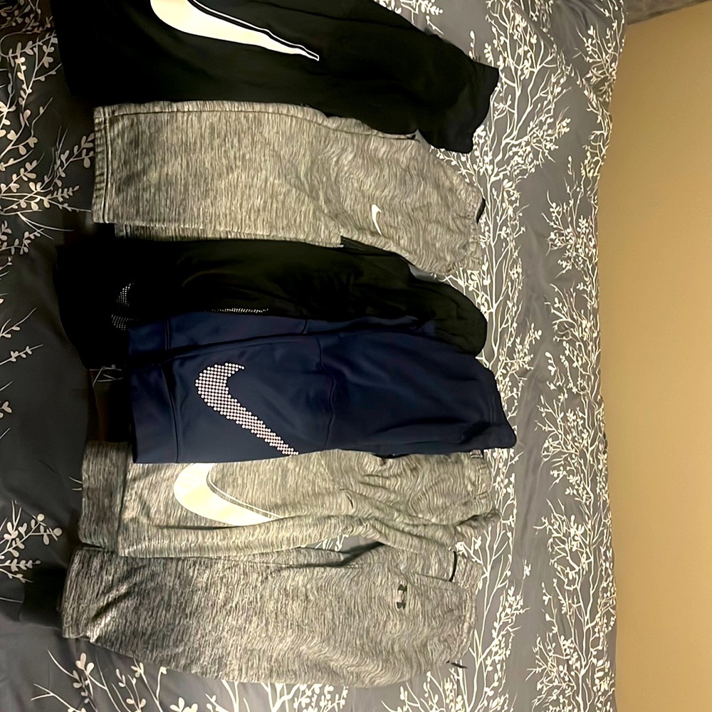 Lots of boys size large Nike, and under armor sweatpants. Six pair total.